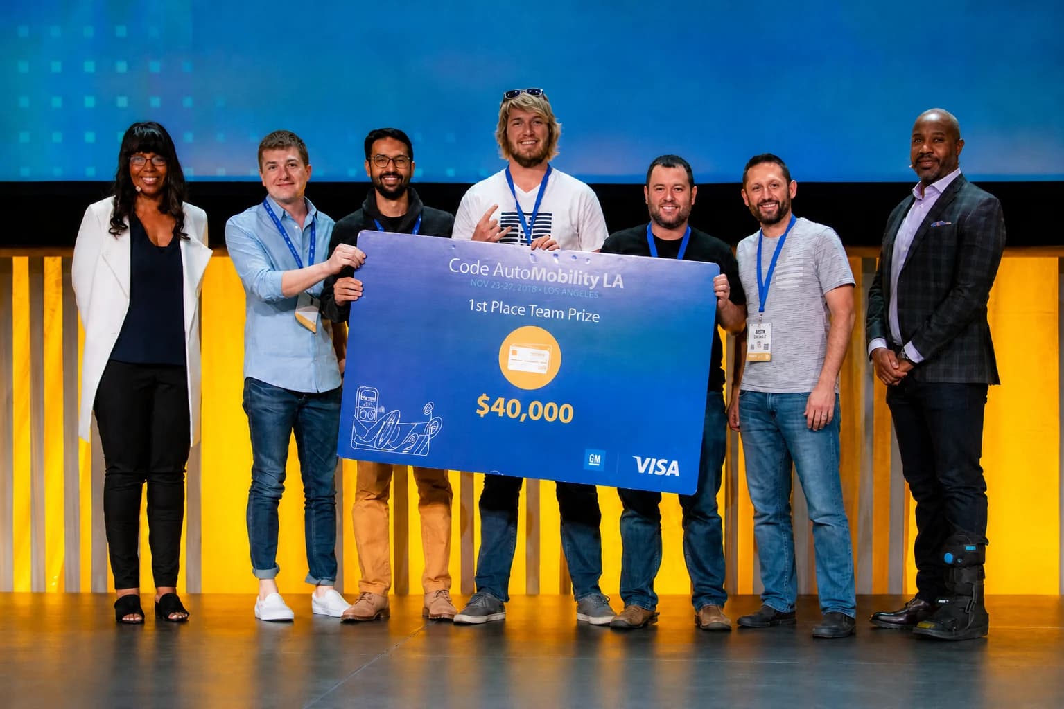 TribalScale on stage at AutoMobility LA receiving the 2018 Code AutoMobility LA grand prize from Visa and General Motors.