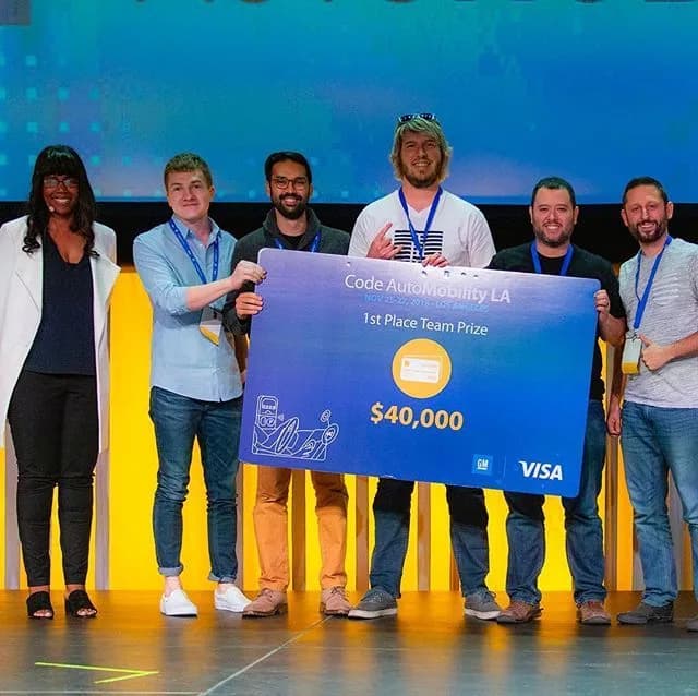 TribalScale celebrating their grand-prize win at the 2018 AutoMobility LA hackathon, with Visa and GM partners.